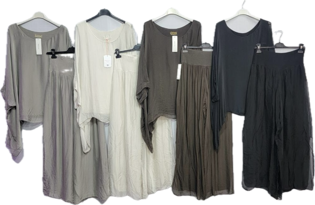 a group of dresses hanging on a rack